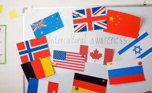 Whiteboard with flags of various countries and the words "Intercultural awareness".