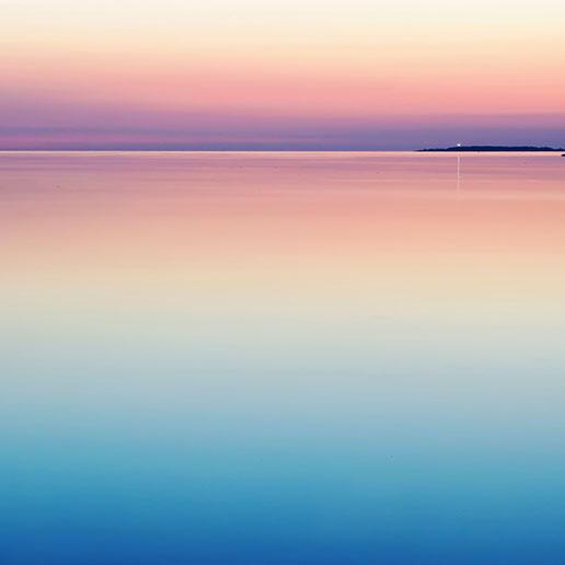 Sunrise over a still lake.