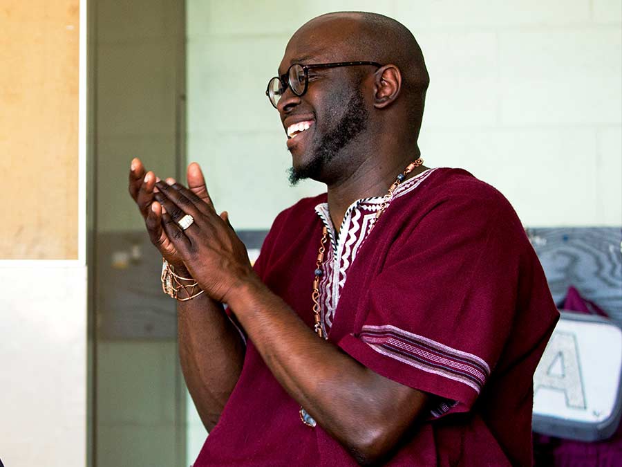 African American man clapping and smiling