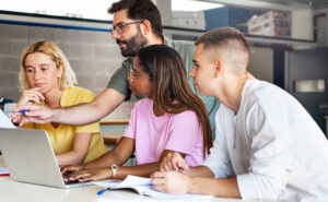 Teacher helping college students