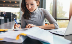 female student doing academic research