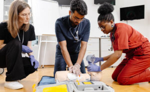 Image of nursing educators teaching nurses how to conduct CPR